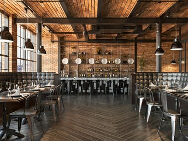 Industrial Luxe restaurant interior with tufted leather booths, metal bar stools, reclaimed wood dining tables, exposed brick walls and dark pendant lighting