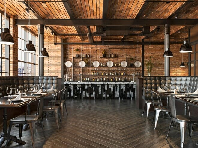 Industrial Luxe restaurant interior with tufted leather booths, metal bar stools, reclaimed wood dining tables, exposed brick walls and dark pendant lighting