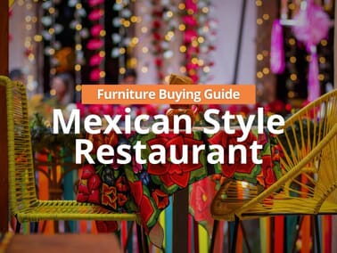 Mexican-style restaurant dining room with warm wood tables, upholstered booths, and ambient lighting