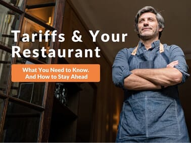 Confident restaurant owner standing in doorway with arms crossed, representing resilience amid 2025 U.S. restaurant tariffs and economic challenges