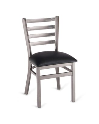 A silver metal ladder-back restaurant chair with a clear coat finish and a black upholstered seat