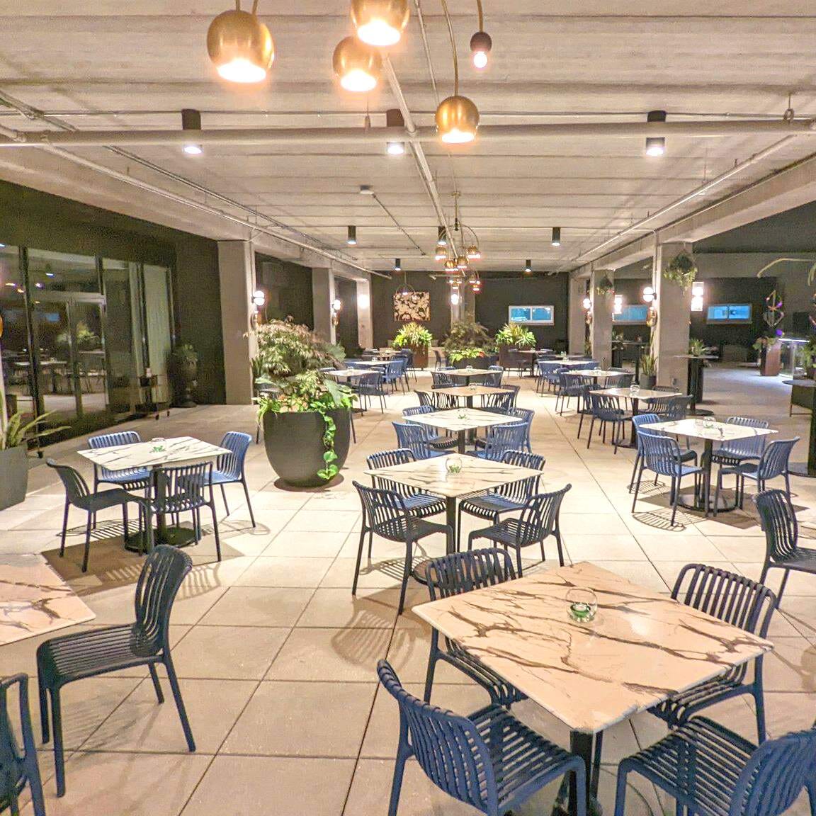 Stackable Indoor/Outdoor Resin Restaurant Chair With Striped Seat and Back in Blue