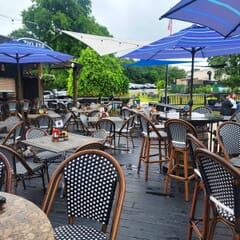 Curved-Back Synthetic Wicker & Bamboo Commercial Outdoor Bar Stool