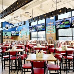 Fully Upholstered Black Metal Commercial Bar Stool with Kidney Shaped Back