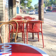 Stackable Indoor/Outdoor Resin Chair With Striped Seat and Back in Red
