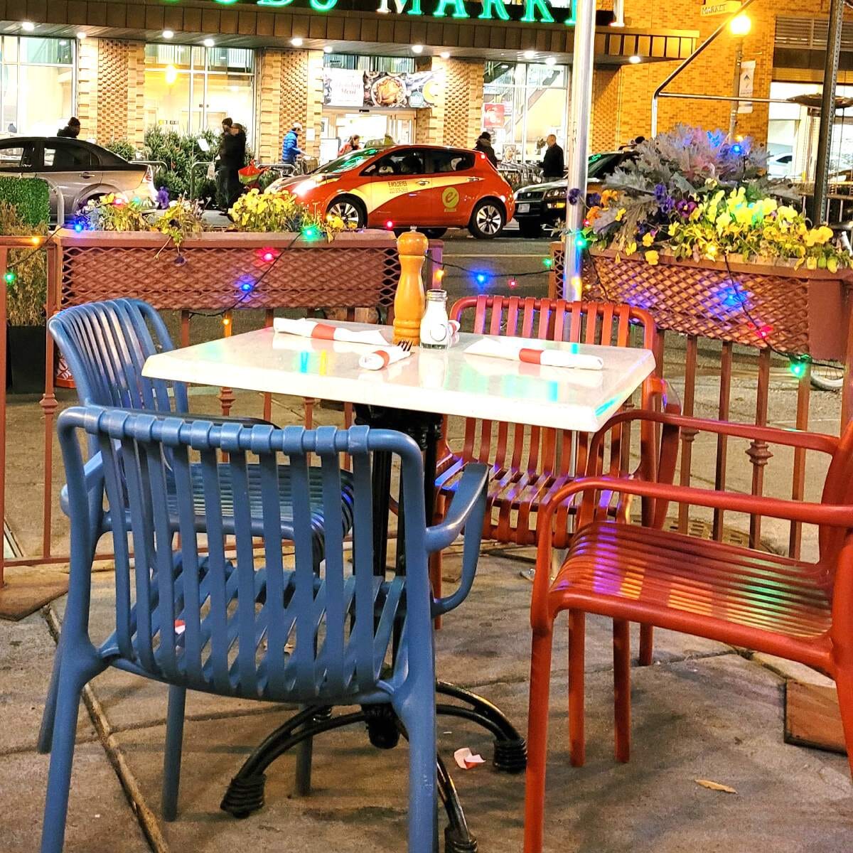 Stackable Indoor/Outdoor Arm Resin Chair With Striped Seat and Back in Blue