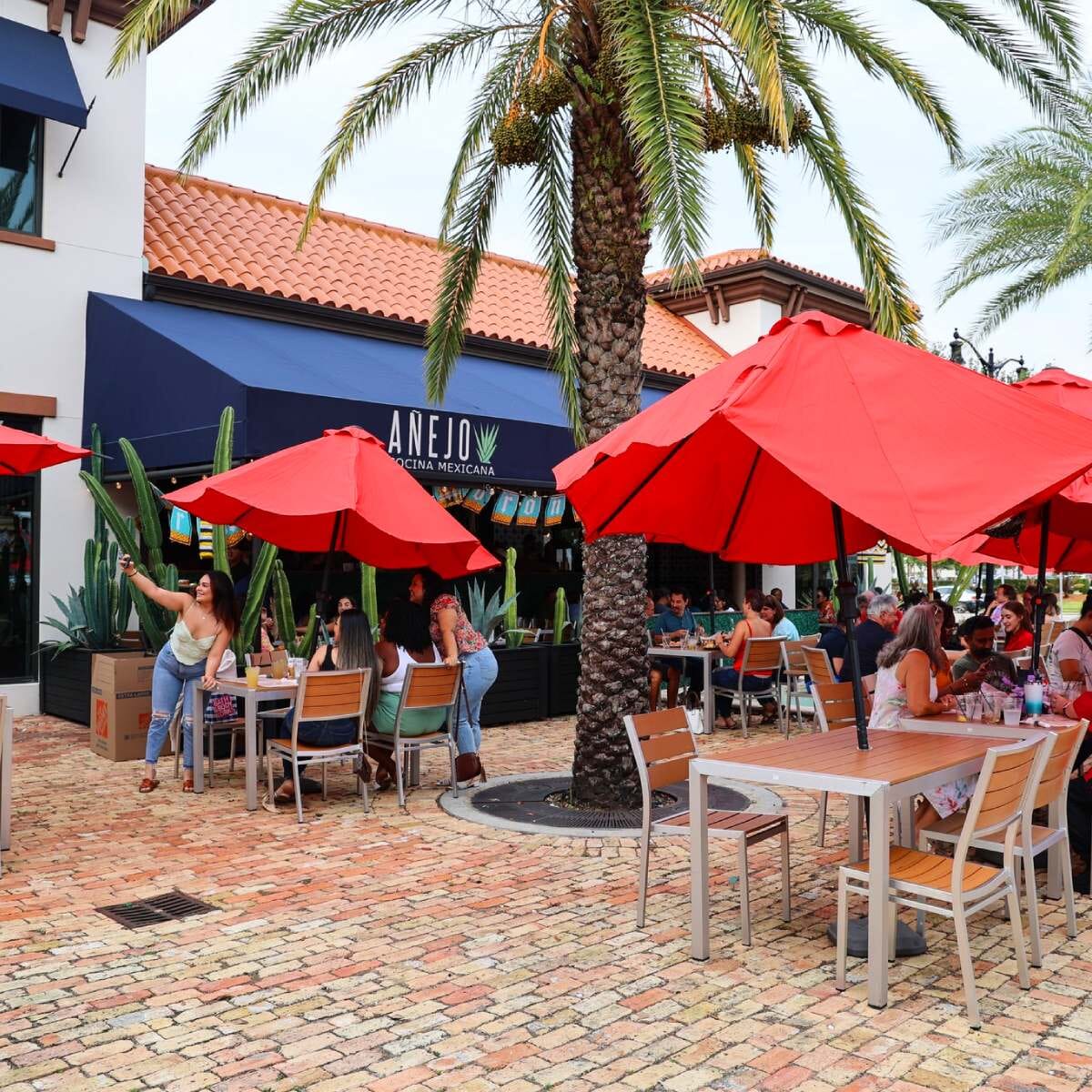 Stackable Outdoor Aluminum Restaurant Chair with Tan Synthetic Teak Wood Slats