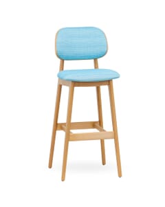 Angled front view of a blue upholstered bar stool, showcasing the seat's padding and wood grain texture on the beechwood legs.