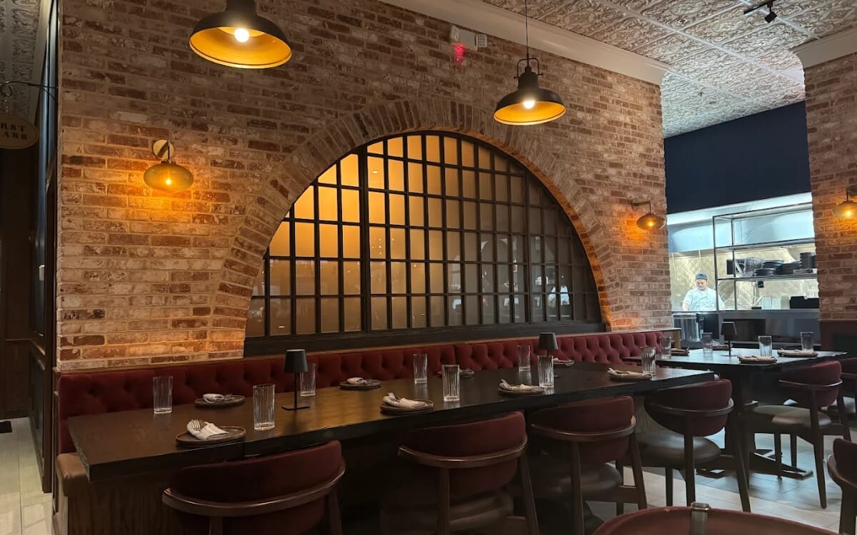 Mumbai Central Indian Fare dining room furnished with Ruby chairs and rustic pewter table tops