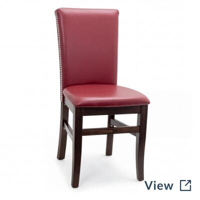 Fully upholstered Stella restaurant chair with nailhead trim.