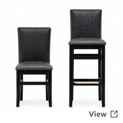 Stella fully upholstered restaurant chair and bar stool with black frames, custom upholstery, and nailhead trim.