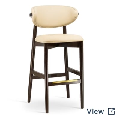 Ruby Modern Walnut Finish Wood Restaurant Bar Stool with Symphony Classic Fog upholstery and brass foot rest.