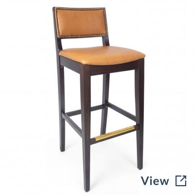Fully upholstered walnut wood Madison bar stool with brass nailhead trim.