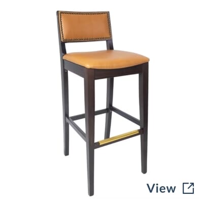 Walnut Madison commercial bar stool with Slalom Saffron back, Repertoire Pashmina seat, chrome nailhead trim, and brass footrest.