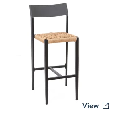 Isola restaurant bar stool with a tan rope seat, solid black back, and black aluminum frame.