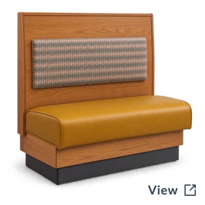 Installed OddBird booth detail showing a rectangular upholstered back pad, exposed wood, and mustard seat.