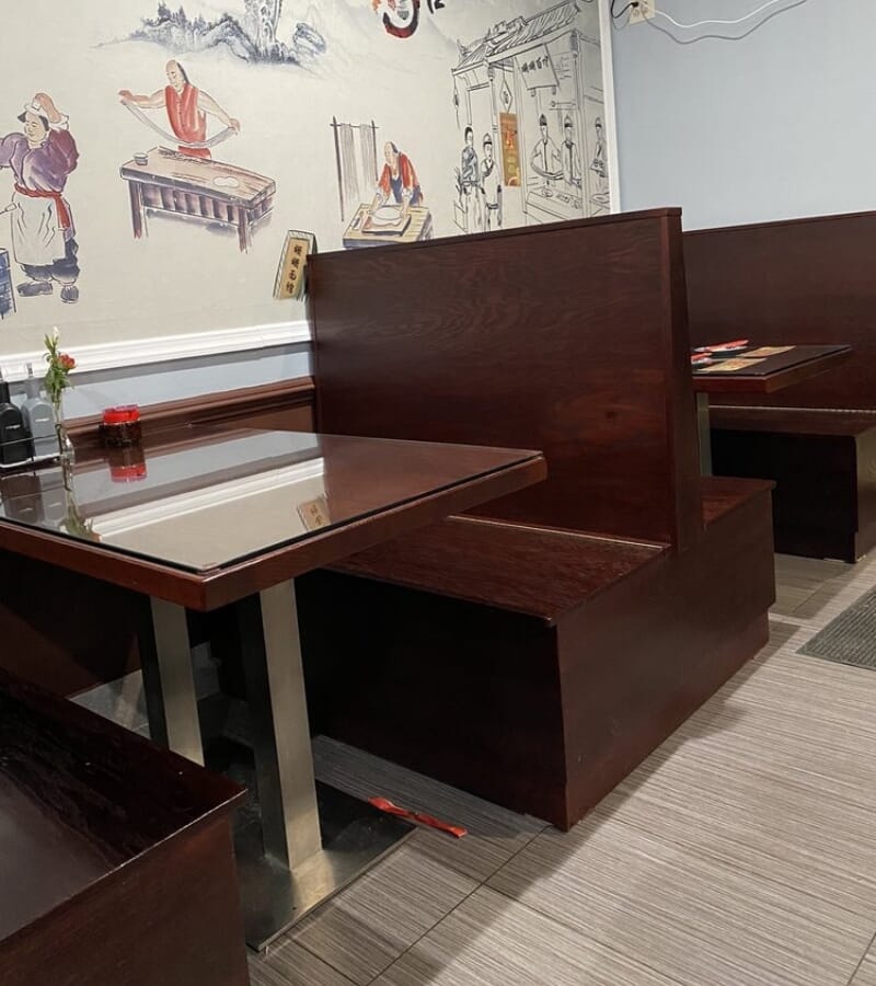 Classic solid wood restaurant booths in a rich mahogany finish at Shan Shan Noodles Chinese restaurant in Parsippany New Jersey.