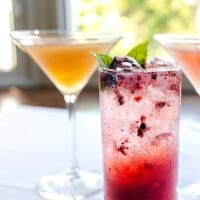 Dining room with cross-back chairs at La Plage Bistro