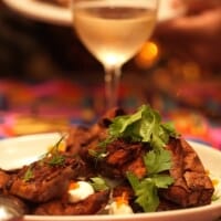 MARCUS DC dining space set for service with upholstered chairs and warm ambient lighting.