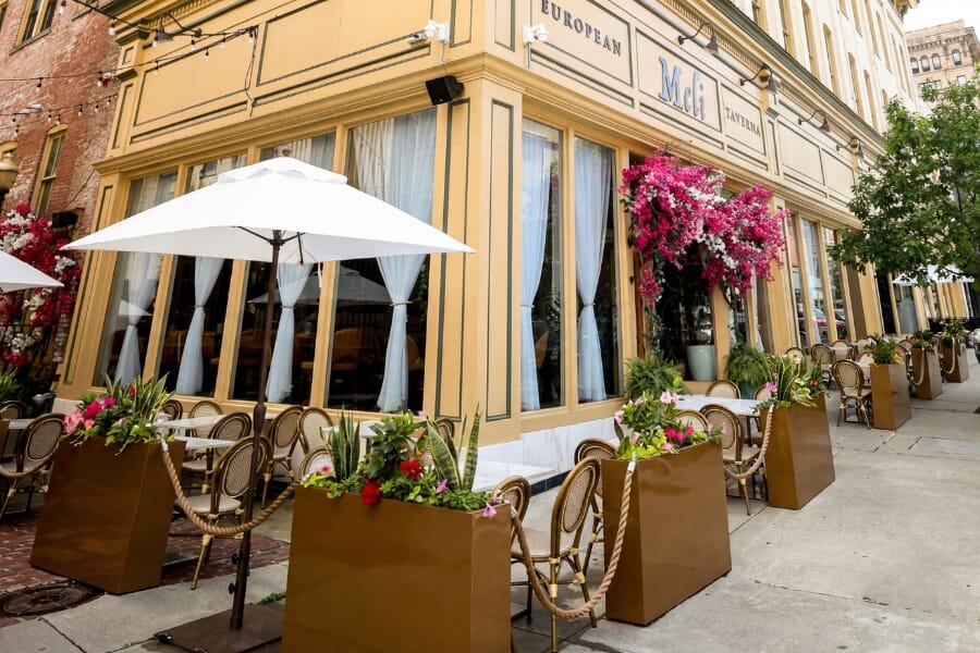 Outdoor dining patio at Meli European Taverna in Easton, PA featuring weather-ready tables, chairs, and lounge seating.
