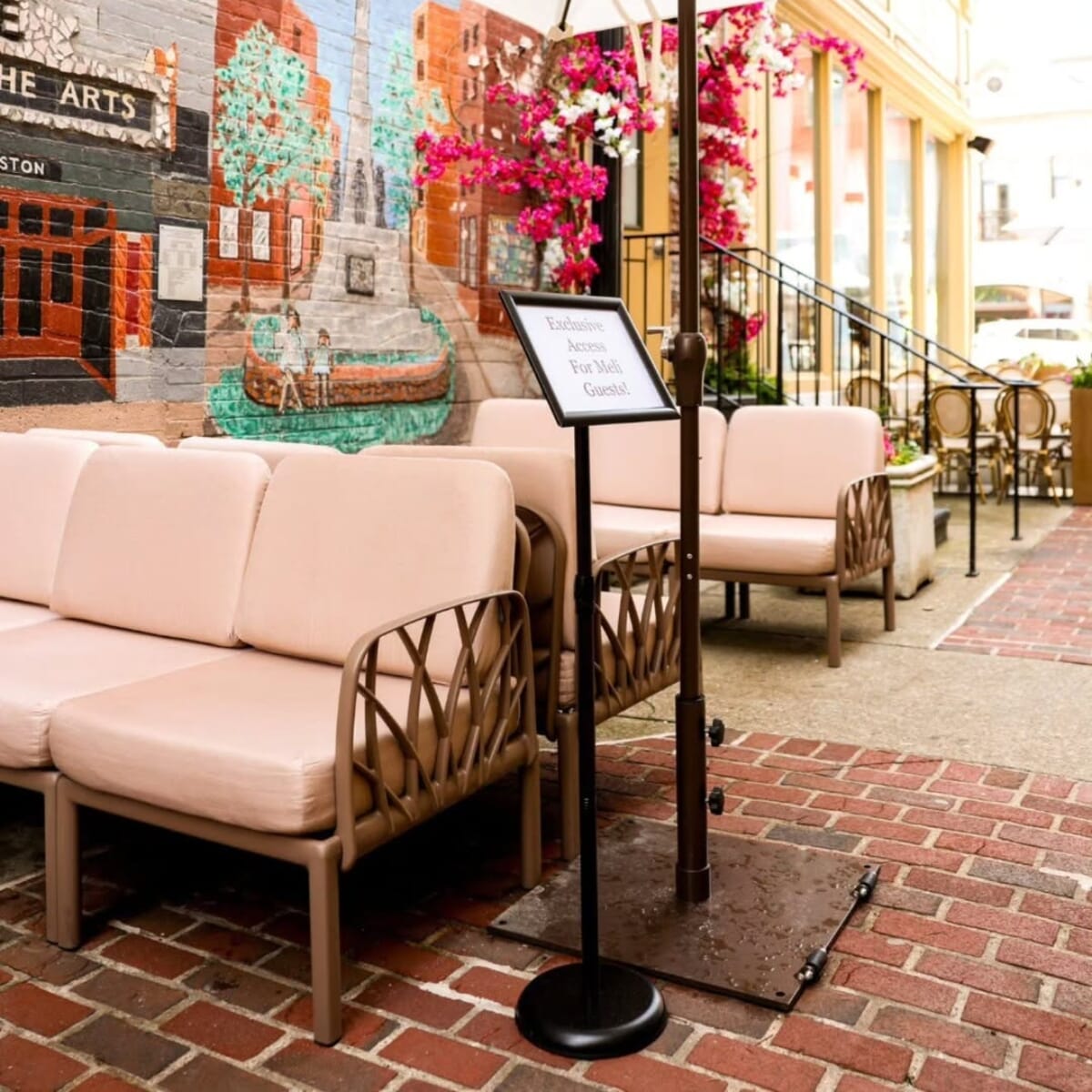 Outdoor dining tables and chairs at Meli European Taverna patio.