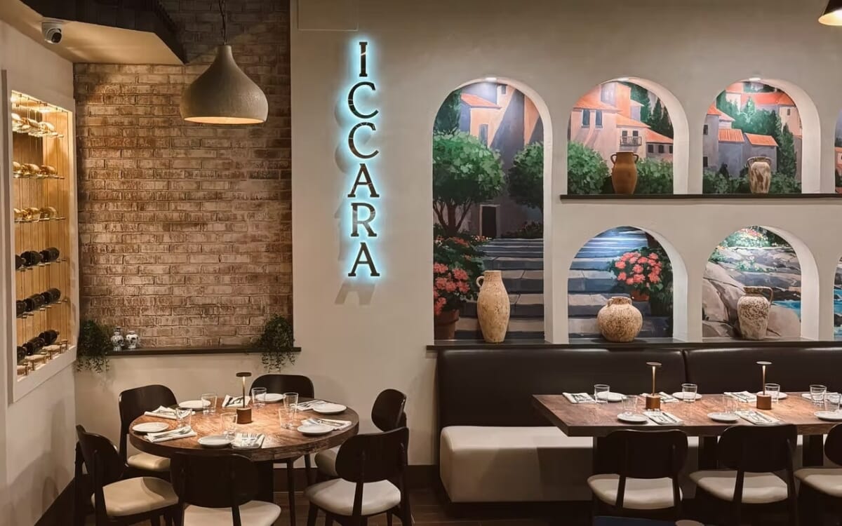 Walnut restaurant chairs and coordinated dining tables inside Villaggio Iccara.