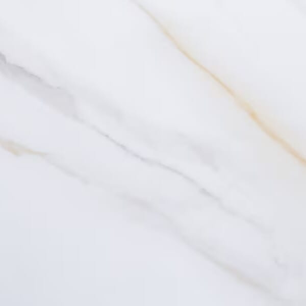 White sintered stone surface with amber veins.