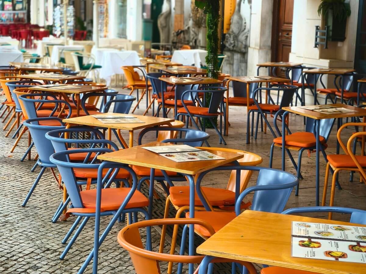 Commercial outdoor dining set with powder-coated frames and performance fabric