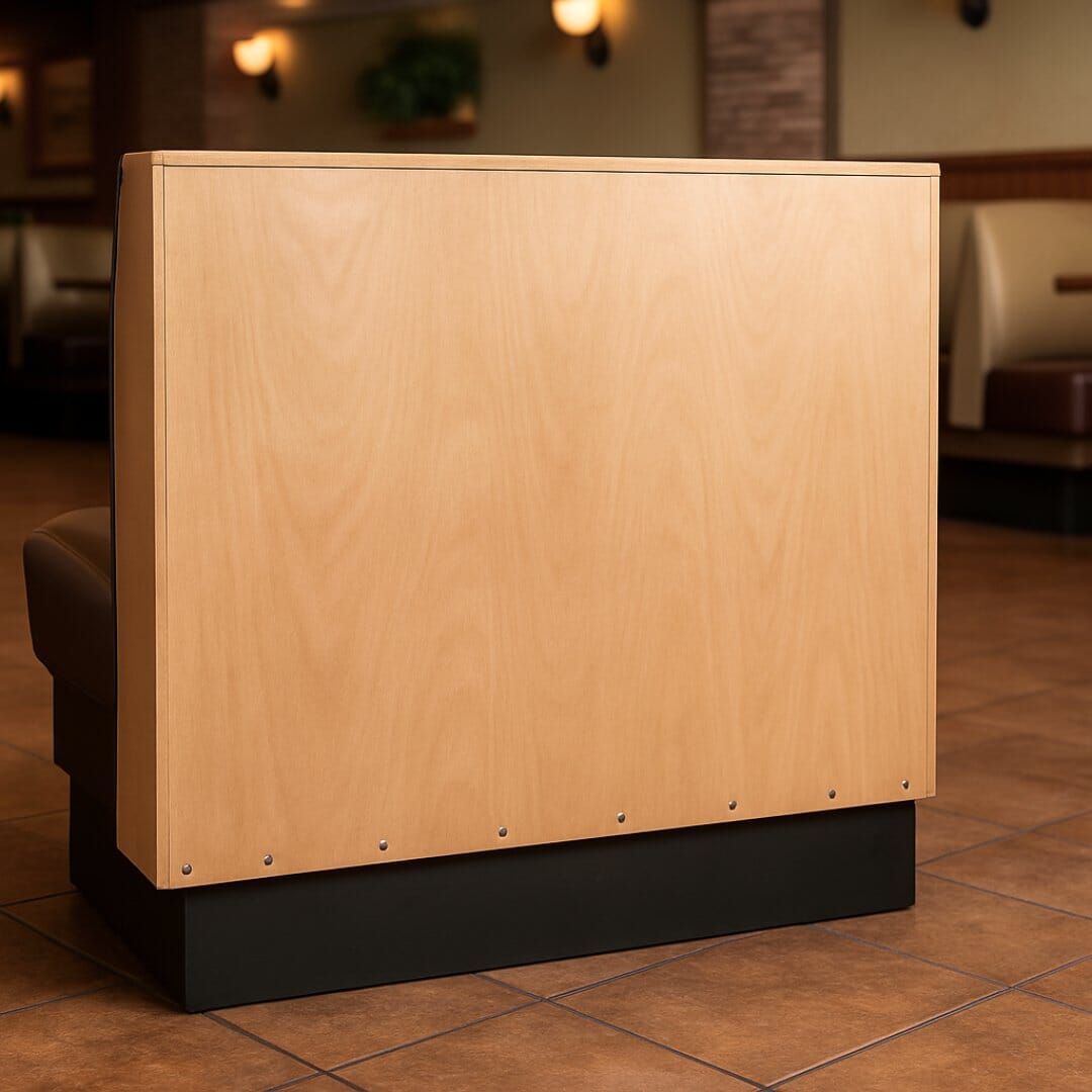 Plywood back panel attached to booth frame