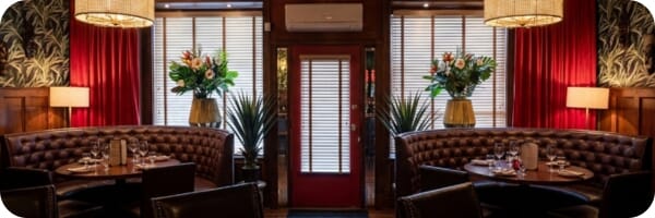 Restaurant interior featuring commercial seating