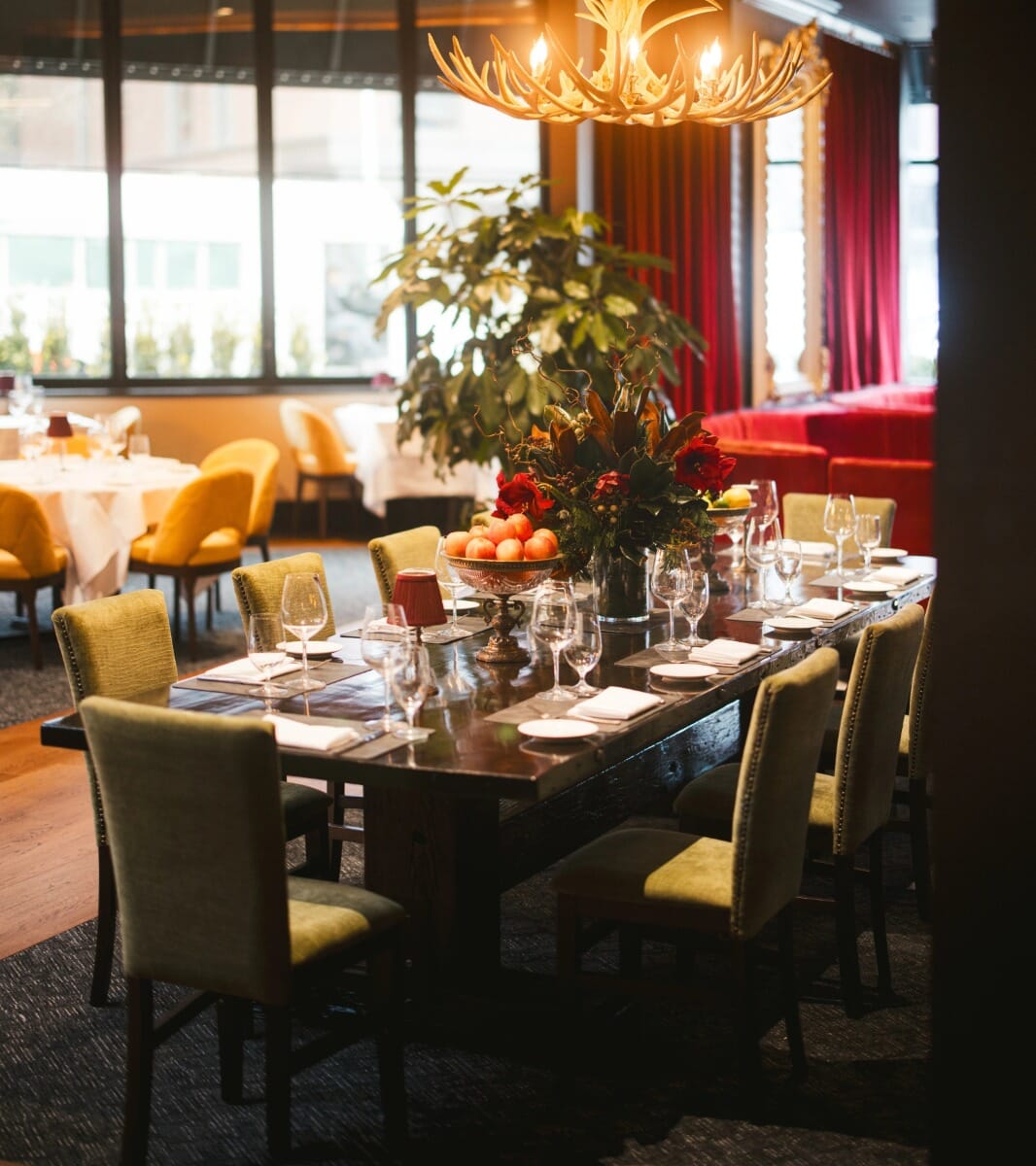 Private dining booth with curved upholstered seating.
