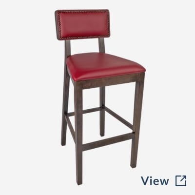 Fully upholstered square back restaurant bar stool with red vinyl, brass nailhead trim, and walnut wood frame used at Central Park Tavern NYC.