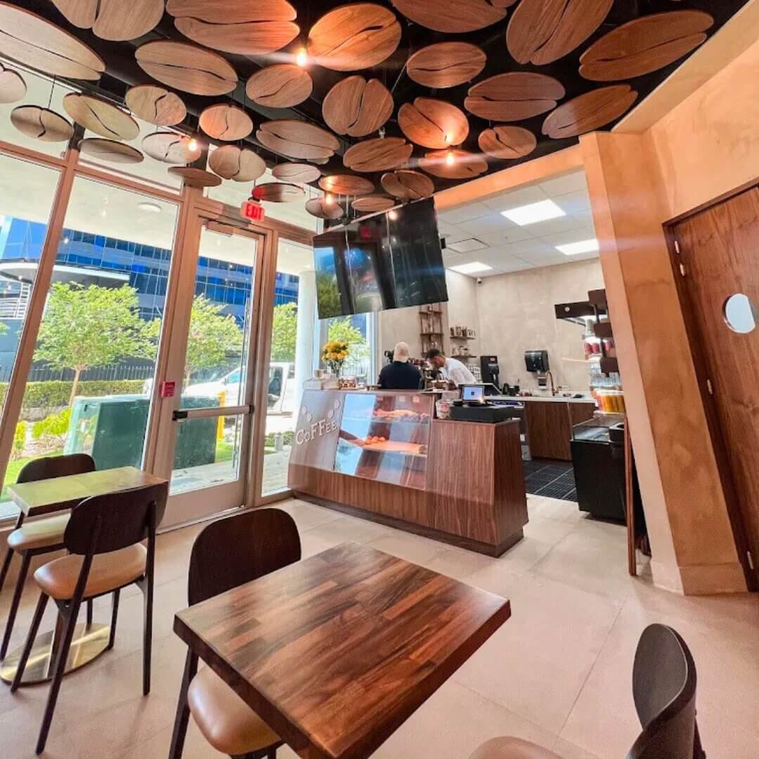 Close-up of Lola walnut restaurant chair and South American walnut table at STL Cafe