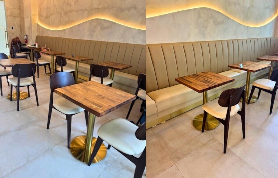 STL Cafe interior with walnut wood chairs, solid wood tables, and gold pedestal bases