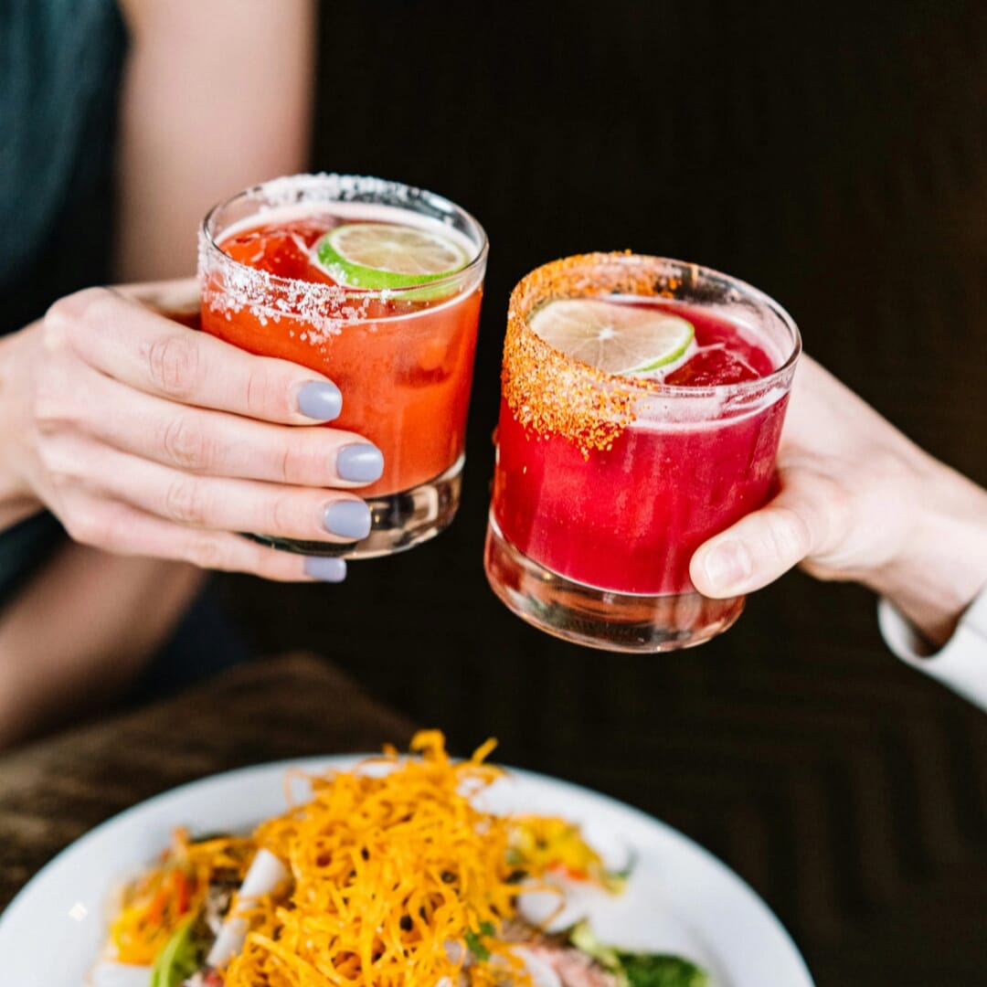 Colorful margaritas with lime and chili rim served at Vida Verde Mexican restaurant in NYC
