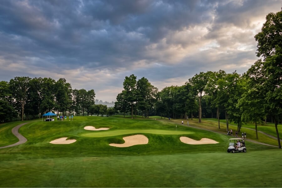 Rush Creek Golf Club championship golf course in Maple Grove Minnesota with manicured greens, bunkers, mature trees, and event venue scenery.